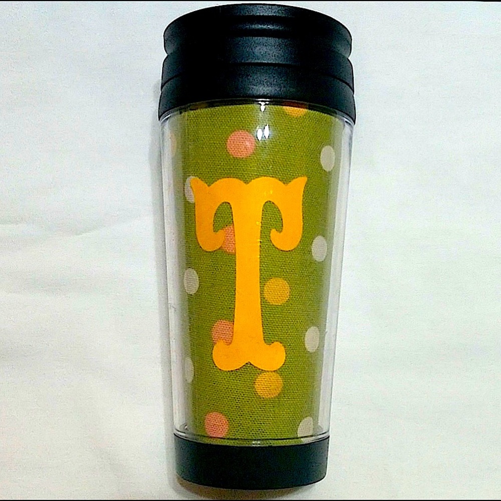 Custom insulated tumbler with initial “T” and colorful polka dots.